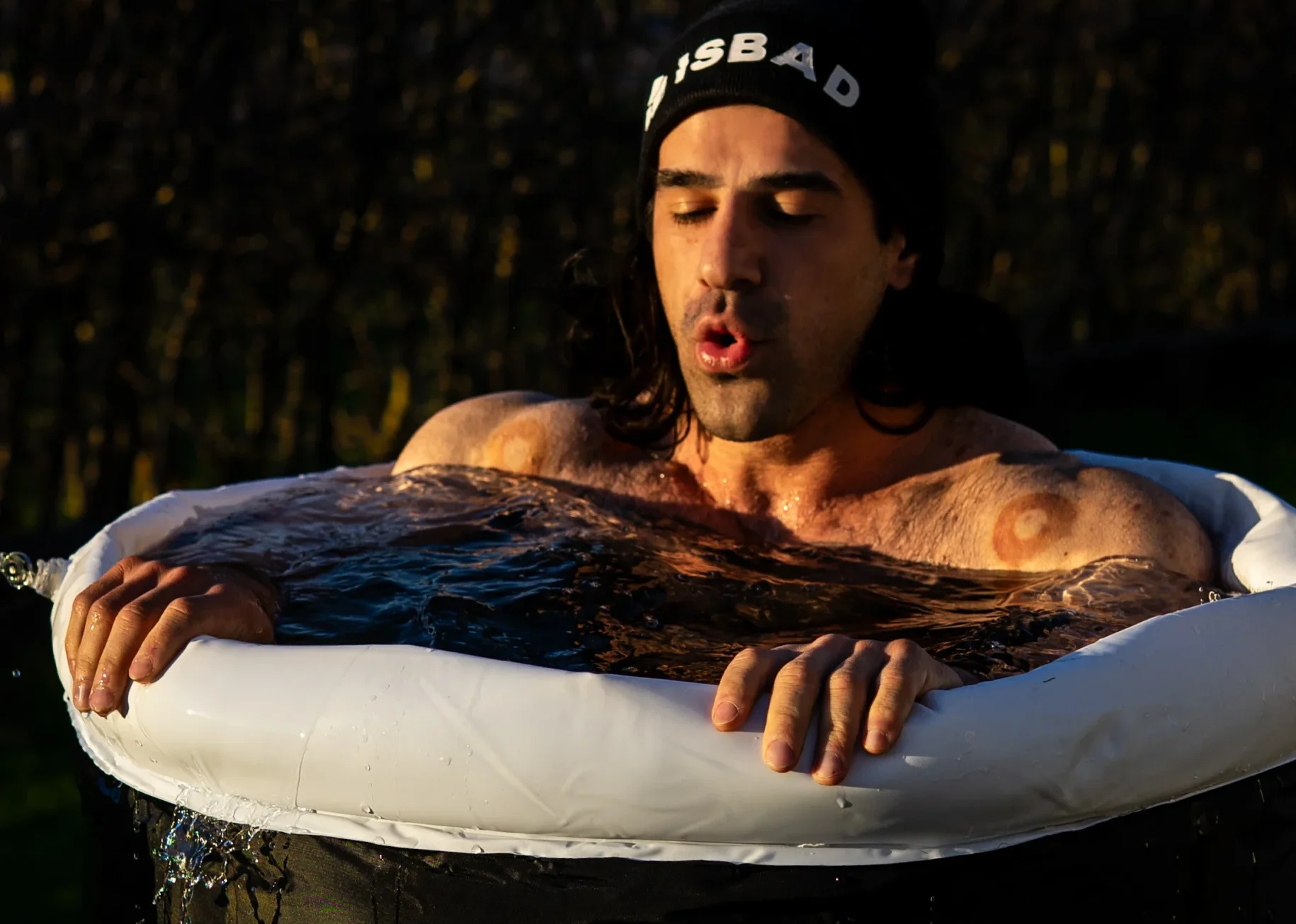 Man ice bathing in ISBAD Premium
